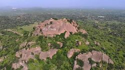 Fly over Indian Hills with Fields and Forest Stock Footage