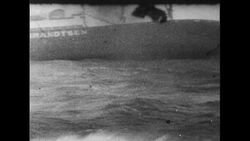 Atlantic Ocean, 1952: The Flying Enterprise is sinking, and Captain Carlsen and his mate Kenneth Dancy cannot be rescued by a helicopter because of harsh water conditions Stock Footage