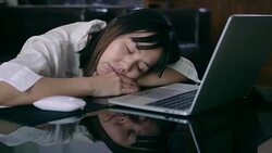 Tired woman sleeping at work Stock Footage