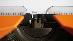Front view of a person writing ISLAMOPHOBIA on an old typewriter Stock Footage