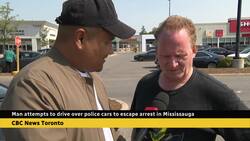 Man charged after trying to drive over police cars Instructional Video