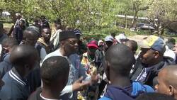 'We’re not animals. We’re human beings.' African migrants in need gather outside City Hall News Clip