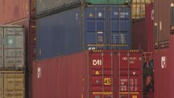 Shipping containers being moved at Teesport News Clip