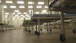 CLEAN : Ugandan health officials visit national stadium, now a virus field hospital News Clip