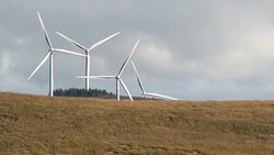 Wind turbines next to a Scottish loch Stock Footage
