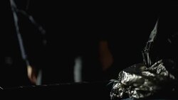 Hitman in hoodie taking handgun from car trunk, serial killer, contract crime Stock Footage