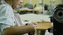 Seamstress Cutting Thread with Scissors Stock Footage