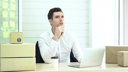 Man working and thinking new idea for project, using laptop check packing list order. Packing box, shipping parcel package and Delivery Shopping online. Stock Footage