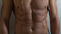 Handsome man with sportive torso taking shower, healthy male body, masculinity Stock Footage