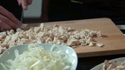 Couple cutting chicken meat Stock Footage