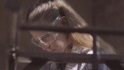 The carpenter girl works in the workshop, restored vintage furniture Stock Footage