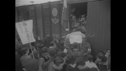 Korean civilians welcome the arrival of POWs at train station during Operation Comeback News Clip