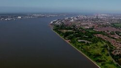 Aerials along River Mersey to Liverpool docks News Clip