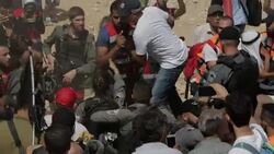 Sequence showing scuffles between Palestinians and IDF near Khan al-Ahmar village, West Bank Stock Footage