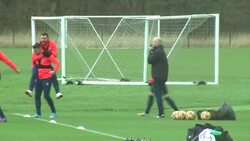 Sean Dyche leading his players through a training session during heavy rain and windy conditions News Clip