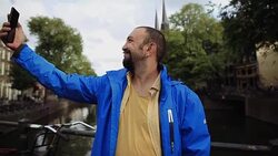 Portrait of Happy Man taking selfie on smartphone, Outdoor Stock Footage