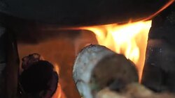 The orange flame in the charcoal stove. Stock Footage