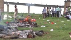 CLEAN : India's Covid graves exposed as Ganges river floods News Clip