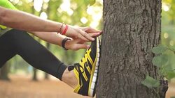 Man exercising / stretching in the park - nature. Stock Footage