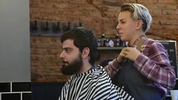 Hairdresser combing while talking with customer Stock Footage