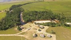 Aerial view of Uruyen indigenous camp at the Auyan tepui. La Gran Sabana, spreads into regions of Guiana Highlands and south-east into Bolívar State all the way to the borders with Brazil and Guyana. Stock Footage