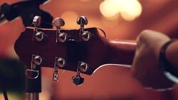 Acoustic guitar in musician hands at party. Stock Footage
