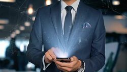 Businessman With Mobile Phone Opens Hologram HUD Interface and Touches Word - SUPPLY AND DEMAND Stock Footage