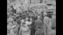 Crowd of reporters around US Assistant Secretary of State Walter Robertson at Tokyo International Airport News Clip