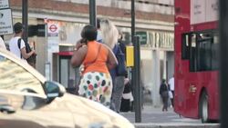 Traffic and people enjoying sunshine around Marble Arch News Clip