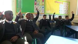 Former West Ham star Anton Ferdinand goes back to school to teach pupils how to stay safe online Stock Footage