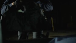 Male bandit opening car trunk and throwing moneybag, bank robbery crime Stock Footage