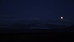 Moon shining above Svalbard landscape News Clip