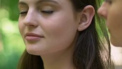 Lesbian kissing her beautiful girlfriend with all tenderness and love outdoors Stock Footage