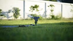 Sprinkler on the grass field Stock Footage