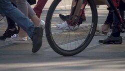 People crossing crosswalk in city. Legs of Crowd People Walking on the Pedestrian Crossing. Slow Motion Stock Footage