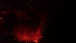 Volcanic Explodes Glowing Lava Into Air At Night Stock Footage