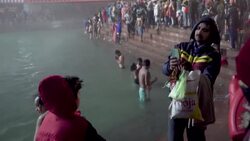 CLEAN : Hindu pilgrims perform morning prayers for India's Kumbh Mela festival News Clip