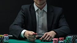 Man in business suit tossing chips to make decision about bets, gambling slow-mo Stock Footage