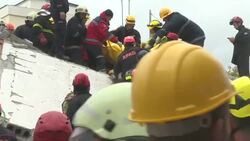 CLEAN : Albania: Rescue teams remove a body from the debris in Durres News Clip