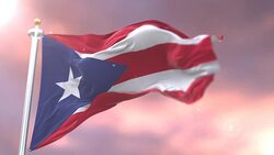 Flag of Puerto Rico waving at wind in slow at sunset, loop Stock Footage