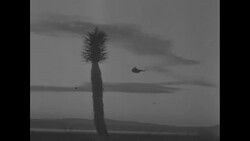 US Marines transported by helicopter to atom bomb test site at Yucca Flat, NV, after bomb is exploded News Clip