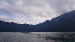 view of landscape limestone mountain rang and green forest with water lake Stock Footage