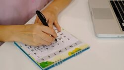 4K shot : Booking vacation plan on calendar. Holiday plan concept. Stock Footage