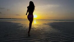 Carefree Asian Chinese girl on ocean beach vacation Stock Footage