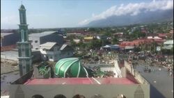 Makeshift morgue, collapsed buildings after Indonesia tsunami Instructional Video