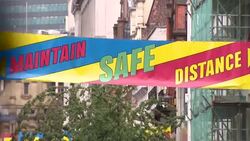 Maintain Safe Distance sign on street of Manchester News Clip