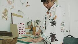 Woman artist is cutting paper Stock Footage