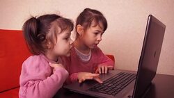 Children playing on laptop. Stock Footage