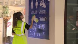 Shoppers in face masks in an Edinburgh shopping centre News Clip