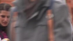 People browsing souvenir stalls in Manezh Square, Moscow News Clip